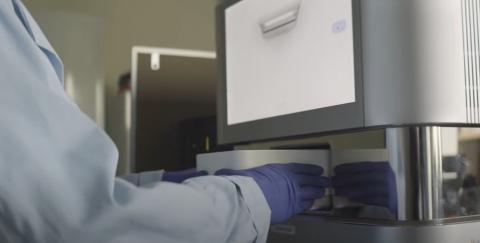 image of someone loading samples onto an Illumina Sequencer